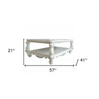57" Antiqued White Wood Coffee Table With Shelf