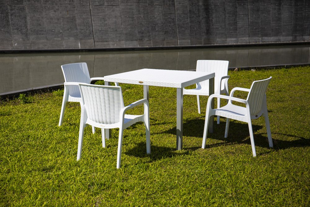 Set of Four 24" White Faux Rattan Heavy Duty Plastic Outdoor Stacking Arm Chairs