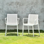 Set of Two White Heavy Duty Plastic Outdoor Stacking Arm Chairs