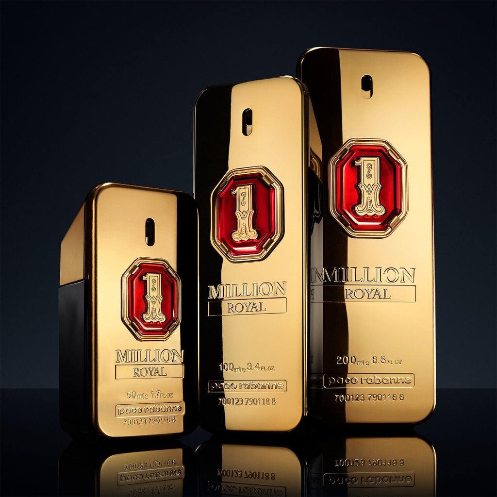 Three gold 'One Million Royal' perfume bottles by Paco Rabanne on a reflective surface with a dark background.